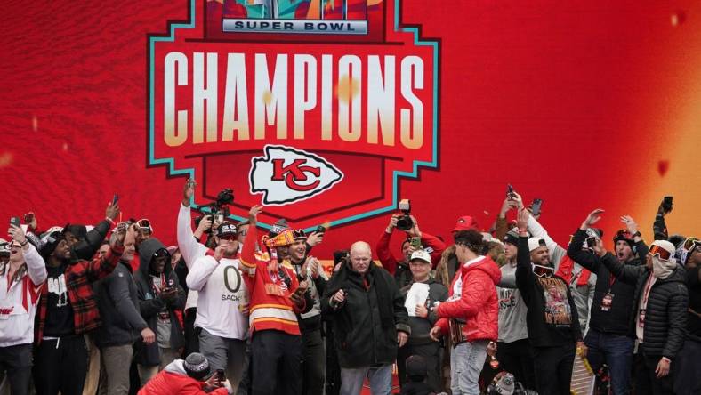 Kansas City Chiefs head coach Andy Reid celebrates with quarterback Patrick Mahomes (15) and other players in 2023 during the Kansas City Chiefs Super Bowl parade. Mandatory Credit: Denny Medley-USA TODAY Sports