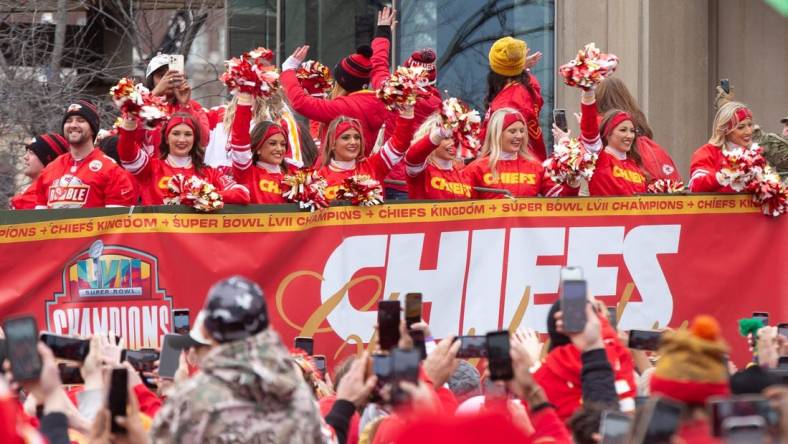 Kansas City Chiefs cheerleaders lead the Super Bowl LVII parade through downtown Kansas City, Missouri.