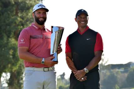 Feb 19, 2023; Pacific Palisades, California, USA; Jon Rahm poses for photos with Tiger Woods following his victory in the final round of The Genesis Invitational golf tournament. Mandatory Credit: Gary A. Vasquez-USA TODAY Sports