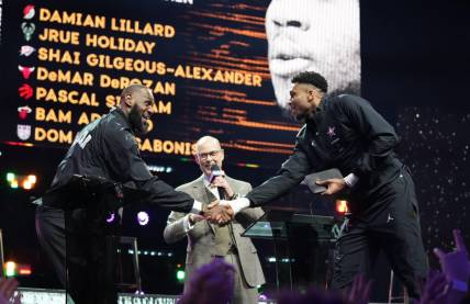 Feb 19, 2023; Salt Lake City, UT, USA; Team LeBron forward LeBron James (left) shakes hands with Team Giannis forward Giannis Antetokounmpo (right) after completing the draft before the 2023 NBA All-Star Game at Vivint Arena. Mandatory Credit: Kyle Terada-USA TODAY Sports