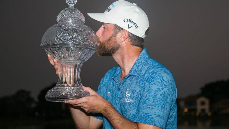 After winning the Honda Classic in a playoff round, Chris Kirk poses for a portrait with the Honda Classic trophy during the final round of the Honda Classic at PGA National Resort & Spa on Sunday, February 26, 2023, in Palm Beach Gardens, FL.