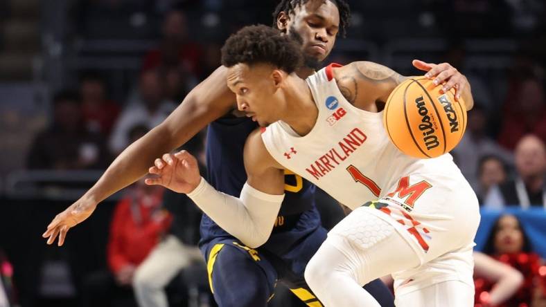 Mar 16, 2023; Birmingham, AL, USA; Maryland Terrapins guard Jahmir Young (1) dribbles against West Virginia Mountaineers guard Joe Toussaint (5) during the second half in the first round of the 2023 NCAA Tournament at Legacy Arena. Mandatory Credit: Vasha Hunt-USA TODAY Sports