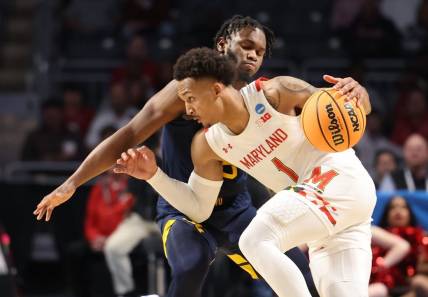 Mar 16, 2023; Birmingham, AL, USA; Maryland Terrapins guard Jahmir Young (1) dribbles against West Virginia Mountaineers guard Joe Toussaint (5) during the second half in the first round of the 2023 NCAA Tournament at Legacy Arena. Mandatory Credit: Vasha Hunt-USA TODAY Sports