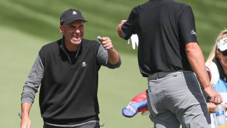 Rocco Mediate fist bumps Steve Stricker after Mediate chipped in for an eagle on the 11th hole during the Galleri Classic at Mission Hills Country Club in Rancho Mirage, March 26, 2023.

Galleri Classic Sunday 8