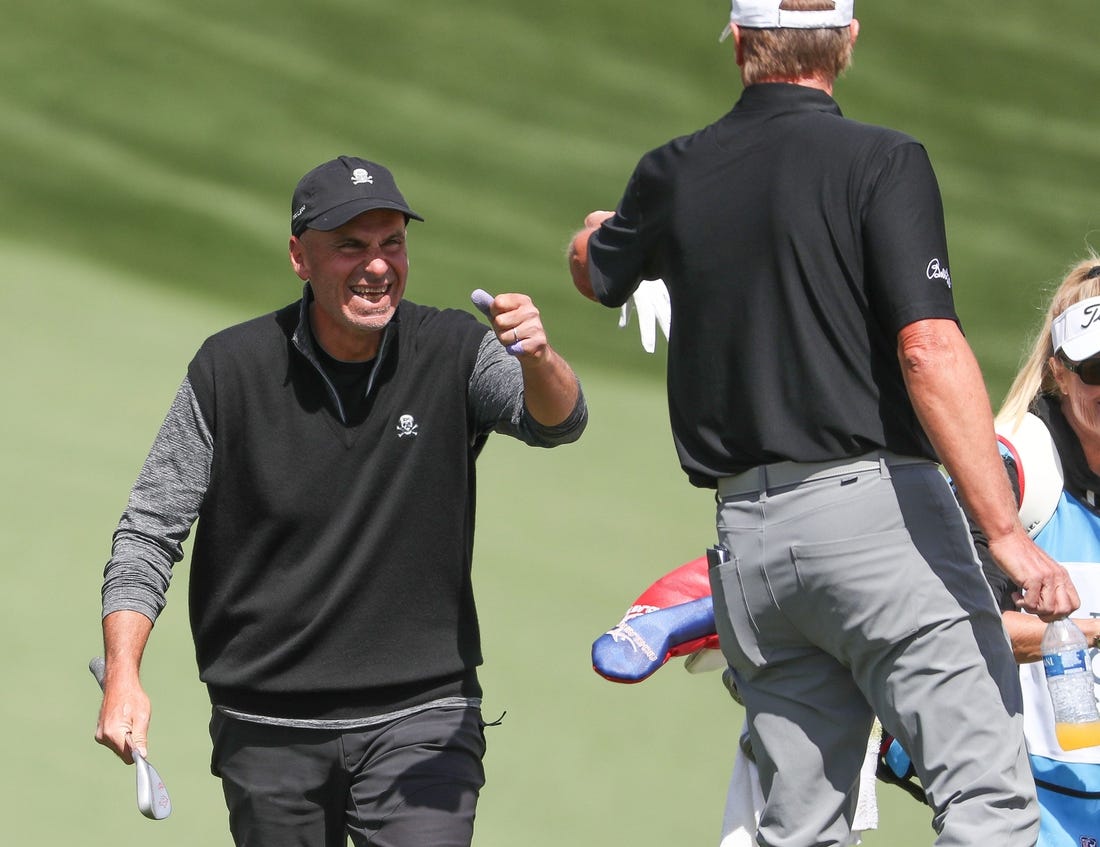 Rocco Mediate fist bumps Steve Stricker after Mediate chipped in for an eagle on the 11th hole during the Galleri Classic at Mission Hills Country Club in Rancho Mirage, March 26, 2023.

Galleri Classic Sunday 8