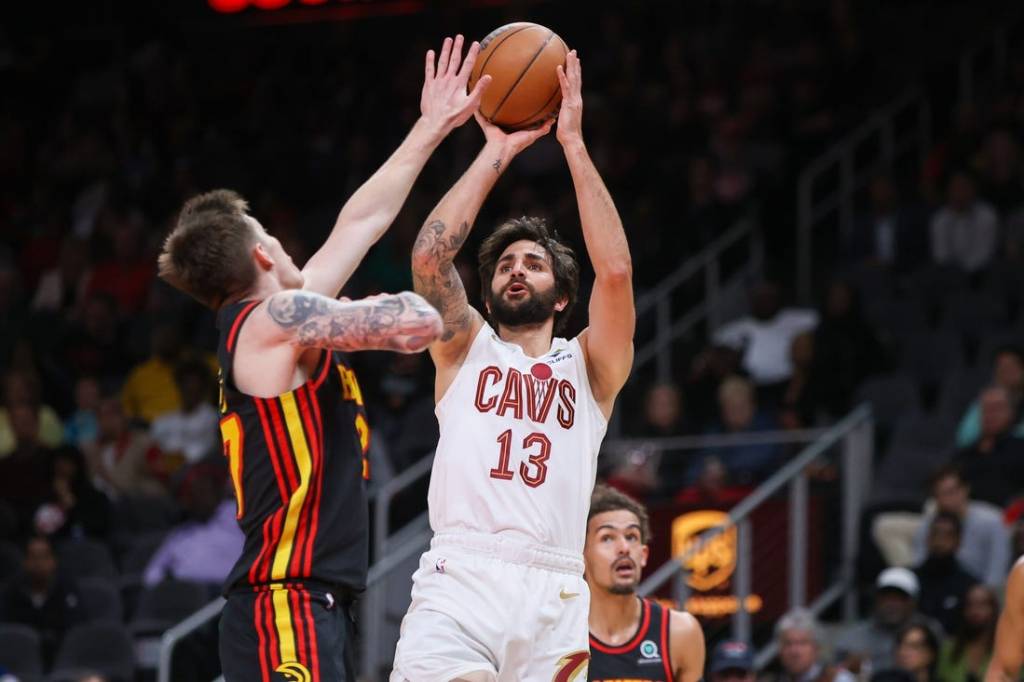 Mar 28, 2023; Atlanta, Georgia, USA; Cleveland Cavaliers guard Ricky Rubio (13) shoots over Atlanta Hawks guard Vit Krejci (27) in the second quarter at State Farm Arena. Mandatory Credit: Brett Davis-USA TODAY Sports