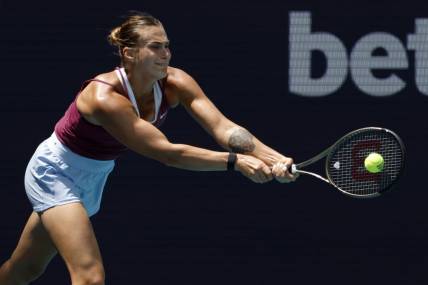 Mar 29, 2023; Miami, Florida, US; Aryna Sabalenka hits a backhand against Sorana Cirstea (ROU) (not pictured) in a women's singles quarterfinal on day ten of the Miami Open at Hard Rock Stadium. Mandatory Credit: Geoff Burke-USA TODAY Sports