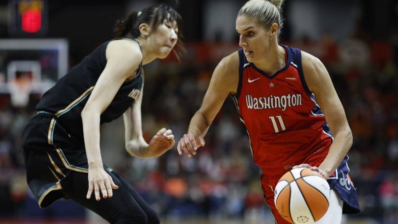 May 19, 2023; Washington, District of Columbia, USA; Washington Mystics forward Elena Delle Donne (11) drives to the basket as New York Liberty center Han Xu (21) defends in the fourth quarter at Entertainment & Sports Arena. Mandatory Credit: Geoff Burke-USA TODAY Sports