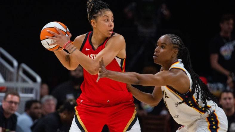 Jun 4, 2023; Indianapolis, Indiana, USA; Las Vegas Aces forward Candace Parker (3) looks to pass the ball while Indiana Fever center Queen Egbo (4) defends in the first half at Gainbridge Fieldhouse. Mandatory Credit: Trevor Ruszkowski-USA TODAY Sports