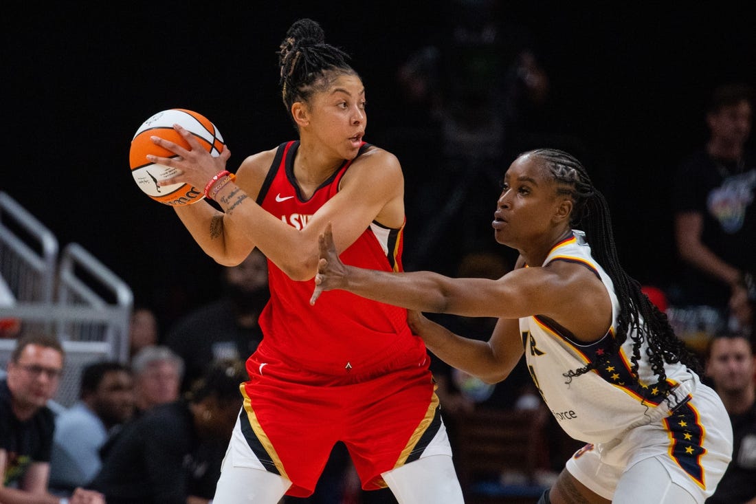 Jun 4, 2023; Indianapolis, Indiana, USA; Las Vegas Aces forward Candace Parker (3) looks to pass the ball while Indiana Fever center Queen Egbo (4) defends in the first half at Gainbridge Fieldhouse. Mandatory Credit: Trevor Ruszkowski-USA TODAY Sports