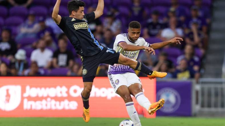 Jun 21, 2023; Orlando, Florida, USA;  Orlando City SC defender Rafael Santos (3) passes the ball past Philadelphia Union midfielder Joaquin Torres (19) in the first half at Exploria Stadium. Mandatory Credit: Nathan Ray Seebeck-USA TODAY Sports