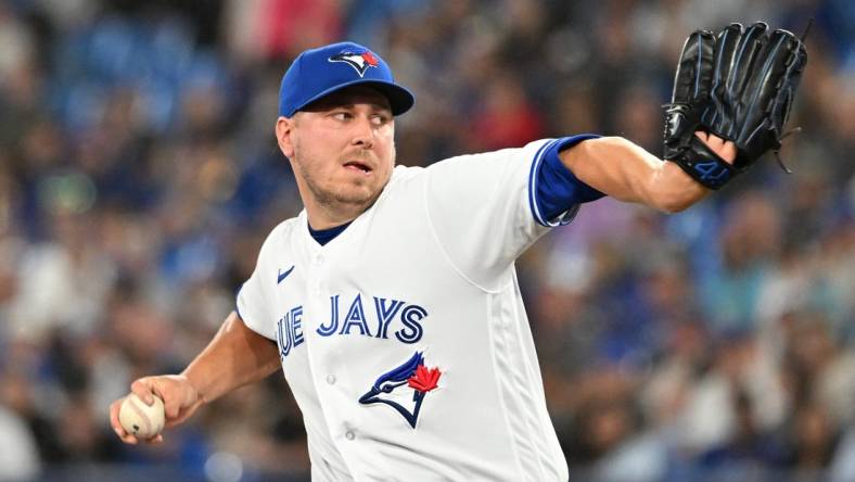 Jun 23, 2023; Toronto, Ontario, CAN;   Toronto Blue Jays relief pitcher Erik Swanson (50) delivers a pitch against the Oakland Athletics in the eighth inning at Rogers Centre. Mandatory Credit: Dan Hamilton-USA TODAY Sports