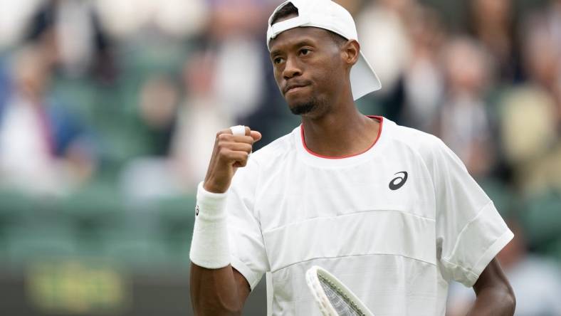 Jul 12, 2023; London, United Kingdom; Christopher Eubanks (USA) reacts to a point during his match against Daniil Medvedev on day ten of Wimbledon at the All England Lawn Tennis and Croquet Club.  Mandatory Credit: Susan Mullane-USA TODAY Sports