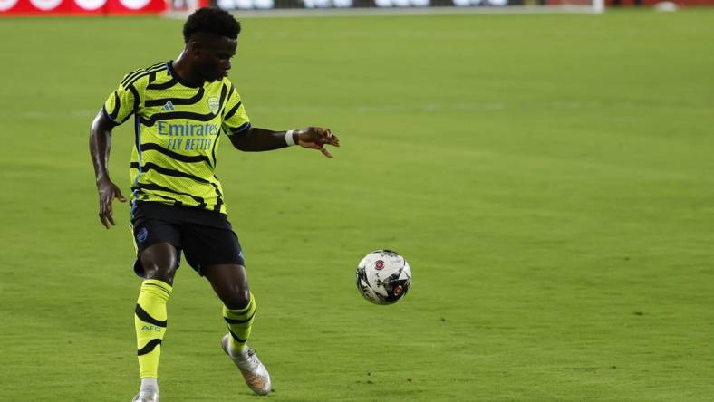 Jul 19, 2023; Washington, DC, USA; Arsenal midfielder Bukayo Saka (7) dribbles the ball against MLS All-Stars in the 2023 MLS All Star Game at Audi Field. Mandatory Credit: Geoff Burke-USA TODAY Sports