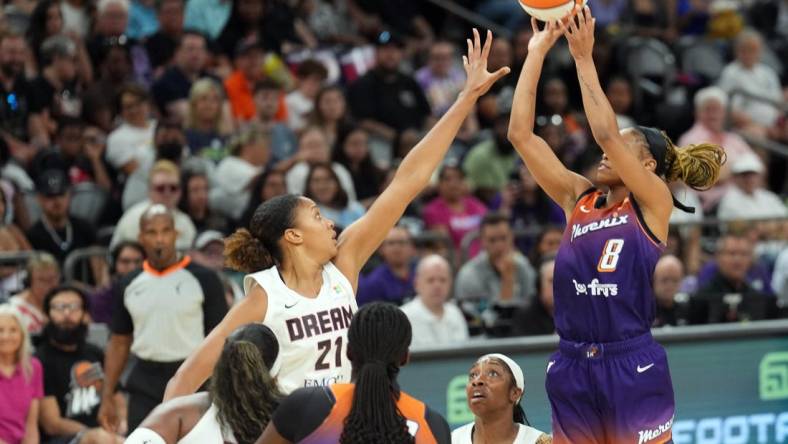 Aug 3, 2023; Phoenix, Arizona, USA; Atlanta Dream center Iliana Rupert (21) defends against Phoenix Mercury guard Moriah Jefferson (8) during the game at at Footprint Center. Mandatory Credit: Joe Camporeale-USA TODAY Sports