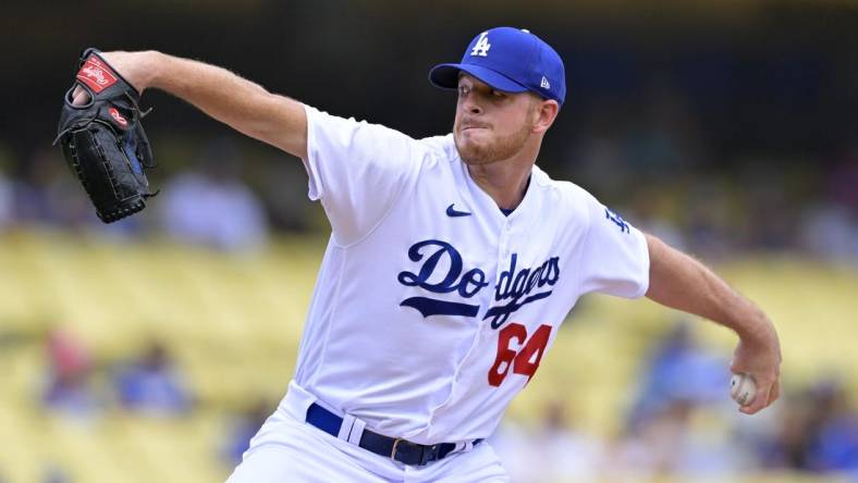 Aug 19, 2023; Los Angeles, California, USA;  Los Angeles Dodgers pitcher Caleb Ferguson (64) throws to the plate in the first inning against the Miami Marlins at Dodger Stadium. Mandatory Credit: Jayne Kamin-Oncea-USA TODAY Sports