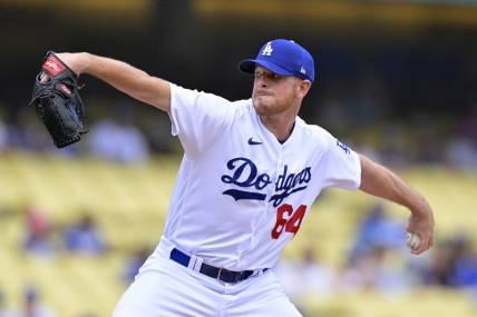 Aug 19, 2023; Los Angeles, California, USA;  Los Angeles Dodgers pitcher Caleb Ferguson (64) throws to the plate in the first inning against the Miami Marlins at Dodger Stadium. Mandatory Credit: Jayne Kamin-Oncea-USA TODAY Sports