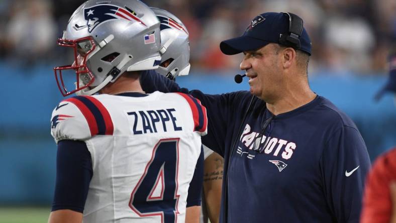 Aug 25, 2023; Nashville, Tennessee, USA; New England Patriots offensive coordinator Bill O'Brien talks with quarterback Bailey Zappe (4) during the first half against the Tennessee Titans at Nissan Stadium. Mandatory Credit: Christopher Hanewinckel-USA TODAY Sports