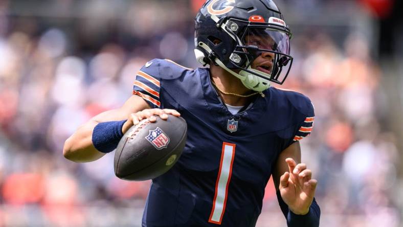 Aug 26, 2023; Chicago, Illinois, USA; Chicago Bears quarterback Justin Fields (1) scrambles against the Buffalo Bills during the first quarter at Soldier Field. Mandatory Credit: Daniel Bartel-USA TODAY Sports