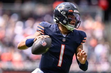 Aug 26, 2023; Chicago, Illinois, USA; Chicago Bears quarterback Justin Fields (1) scrambles against the Buffalo Bills during the first quarter at Soldier Field. Mandatory Credit: Daniel Bartel-USA TODAY Sports