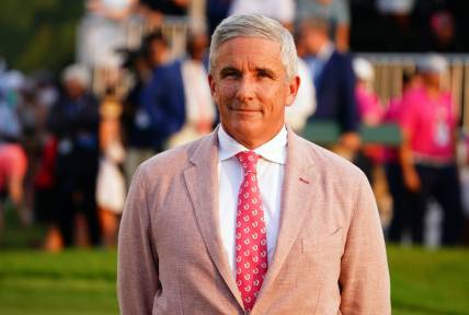 Aug 27, 2023; Atlanta, Georgia, USA; PGA TOUR commissioner Jay Monahan waits on the 18th green during the final round of the TOUR Championship golf tournament at East Lake Golf Club. Mandatory Credit: John David Mercer-USA TODAY Sports