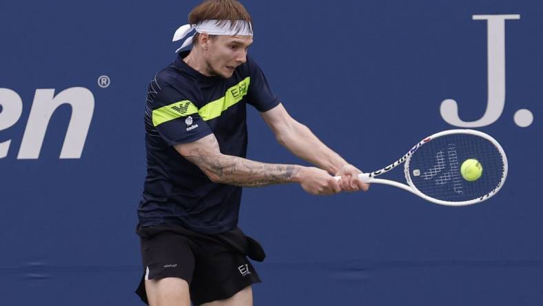 Aug 28, 2023; Flushing, NY, USA; Alexander Bublik of Kazakhstan hits a backhand against Dominic Thiem of Austria (not pictured) on day one of the 2023 US Open at the Billie Jean King National Tennis Center. Mandatory Credit: Geoff Burke-USA TODAY Sports