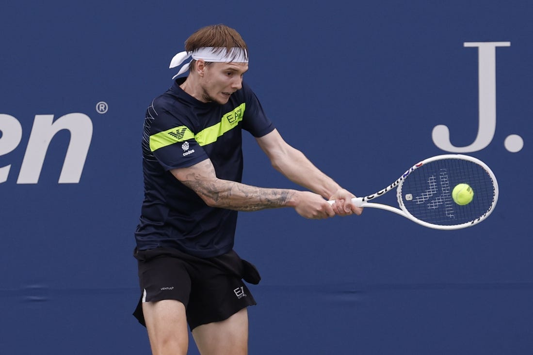 Aug 28, 2023; Flushing, NY, USA; Alexander Bublik of Kazakhstan hits a backhand against Dominic Thiem of Austria (not pictured) on day one of the 2023 US Open at the Billie Jean King National Tennis Center. Mandatory Credit: Geoff Burke-USA TODAY Sports