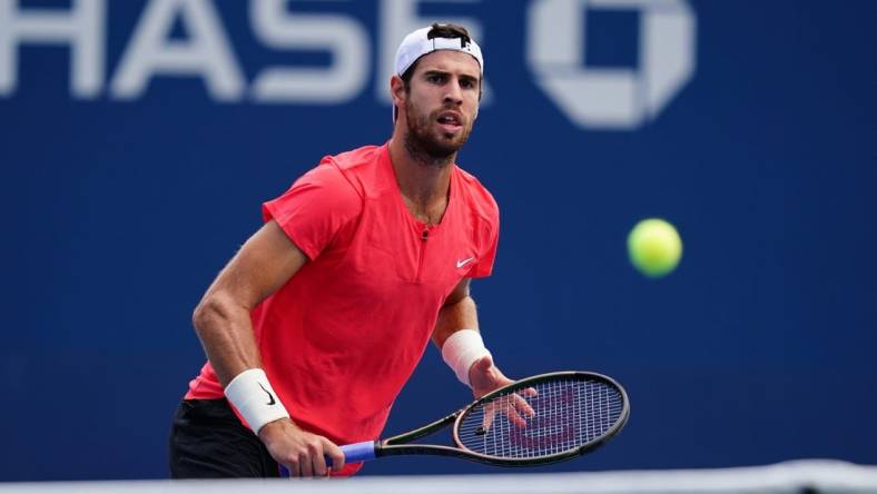 Aug 29, 2023; Flushing, NY, USA; Karen Khachanov in action against Michael Mmoh of the United States on day two of the 2023 U.S. Open tennis tournament at the USTA Billie Jean King National Tennis Center. Mandatory Credit: Jerry Lai-USA TODAY Sports