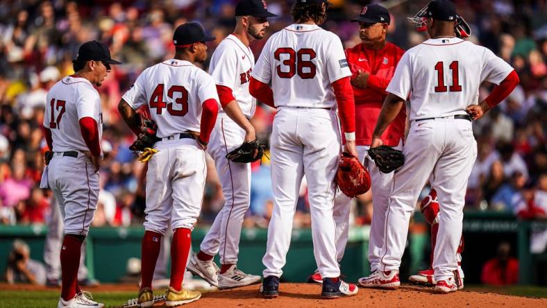 Aug 30, 2023; Boston, Massachusetts, USA; Boston Red Sox manager Alex Cora (13) brings in relief pitcher Joe Jacques (78) as they take on the Houston Astros in the third inning at Fenway Park. Mandatory Credit: David Butler II-USA TODAY Sports