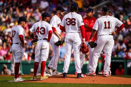 Aug 30, 2023; Boston, Massachusetts, USA; Boston Red Sox manager Alex Cora (13) brings in relief pitcher Joe Jacques (78) as they take on the Houston Astros in the third inning at Fenway Park. Mandatory Credit: David Butler II-USA TODAY Sports