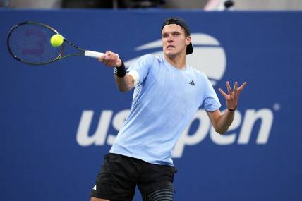 Sep 1, 2023; Flushing, NY, USA; Jakub Mensik of the Czech Republic hits to Taylor Fritz of the United States on day five of the 2023 U.S. Open tennis tournament at USTA Billie Jean King National Tennis Center. Mandatory Credit: Danielle Parhizkaran-USA TODAY Sports