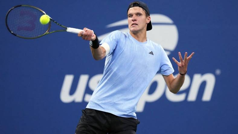 Sep 1, 2023; Flushing, NY, USA; Jakub Mensik of the Czech Republic hits to Taylor Fritz of the United States on day five of the 2023 U.S. Open tennis tournament at USTA Billie Jean King National Tennis Center. Mandatory Credit: Danielle Parhizkaran-USA TODAY Sports