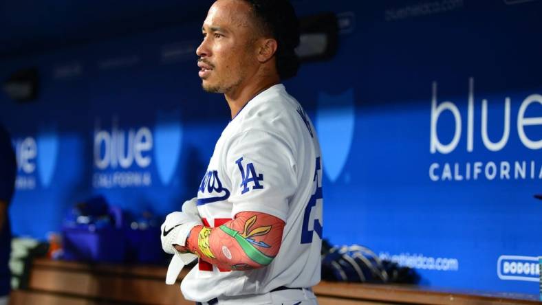 September 1, 2023; Los Angeles, California, USA; Los Angeles Dodgers second baseman Kolten Wong (25) reacts after hitting a three run home run against the Atlanta Braves during the eighth inning at Dodger Stadium. Mandatory Credit: Gary A. Vasquez-USA TODAY Sports