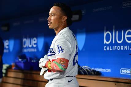 September 1, 2023; Los Angeles, California, USA; Los Angeles Dodgers second baseman Kolten Wong (25) reacts after hitting a three run home run against the Atlanta Braves during the eighth inning at Dodger Stadium. Mandatory Credit: Gary A. Vasquez-USA TODAY Sports