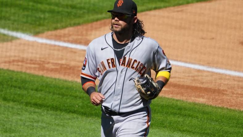 Sep 17, 2023; Denver, Colorado, USA; San Francisco Giants shortstop Brandon Crawford (35) leaves the field in the fourth inning against the Colorado Rockies at Coors Field. Mandatory Credit: Ron Chenoy-USA TODAY Sports