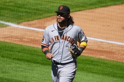 Sep 17, 2023; Denver, Colorado, USA; San Francisco Giants shortstop Brandon Crawford (35) leaves the field in the fourth inning against the Colorado Rockies at Coors Field. Mandatory Credit: Ron Chenoy-USA TODAY Sports