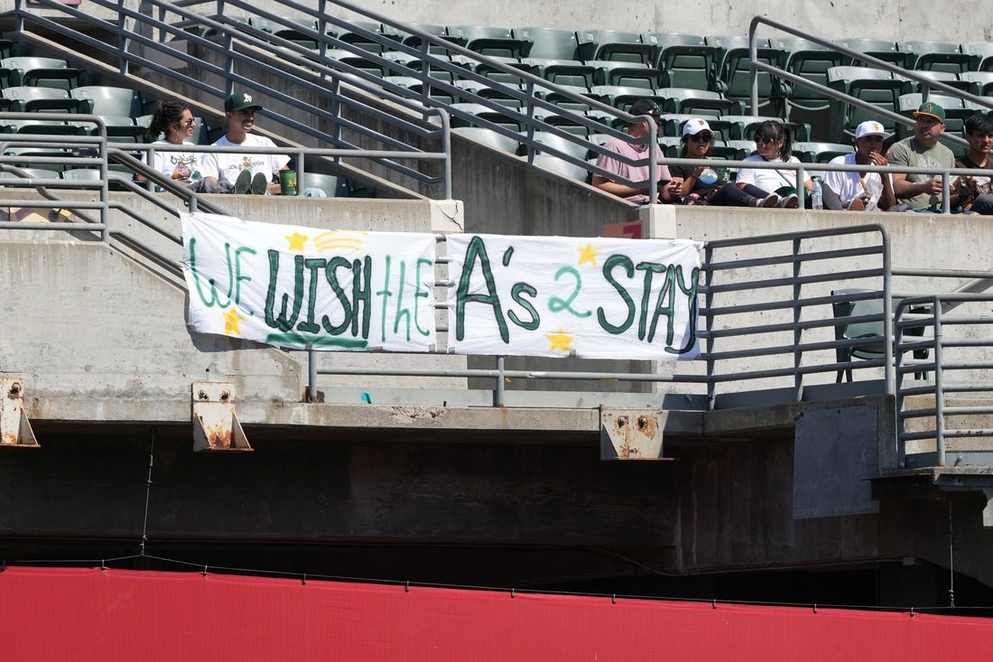 Sep 17, 2023; Oakland, California, USA; Oakland Athletics fans hang a sign in the right field bleachers during the fourth inning against the San Diego Padres at Oakland-Alameda County Coliseum. Mandatory Credit: Darren Yamashita-USA TODAY Sports