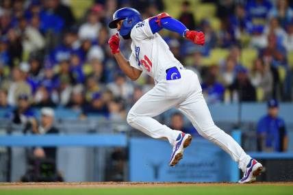 Sep 21, 2023; Los Angeles, California, USA; Los Angeles Dodgers second baseman Amed Rosario (31) runs after hitting a single against the San Francisco Giants during the fourth inning at Dodger Stadium. Mandatory Credit: Gary A. Vasquez-USA TODAY Sports