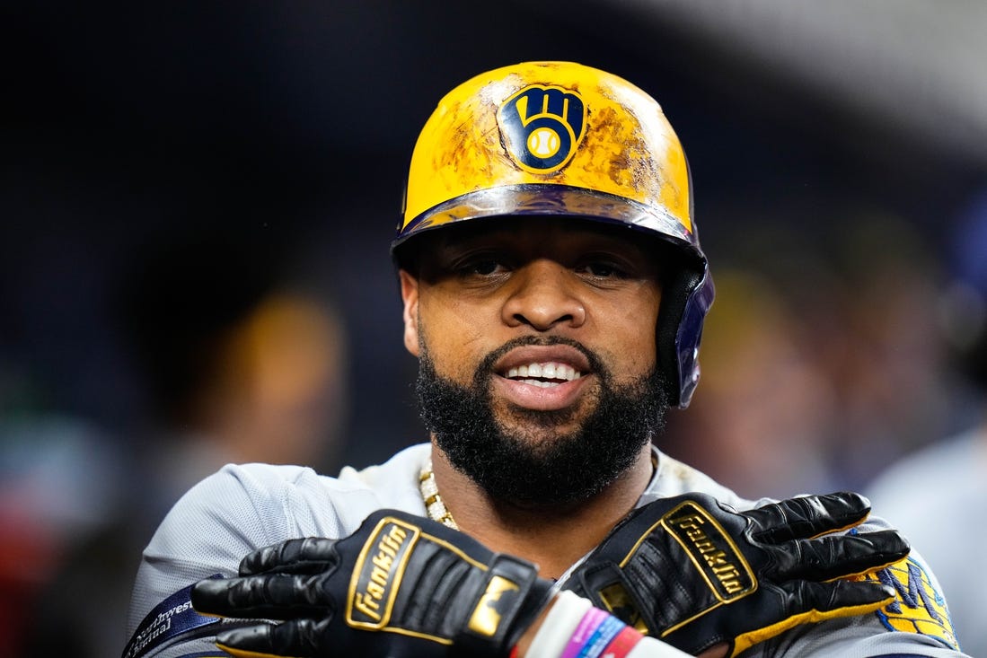 Sep 23, 2023; Miami, Florida, USA; Milwaukee Brewers first baseman Carlos Santana (41) celebrates hitting a three run home run against the Miami Marlins during the sixth inning at loanDepot Park. Mandatory Credit: Rich Storry-USA TODAY Sports