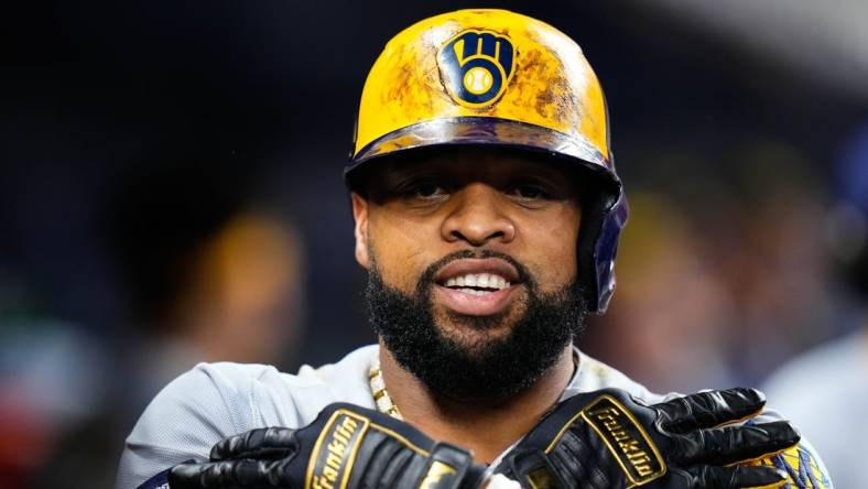 Sep 23, 2023; Miami, Florida, USA; Milwaukee Brewers first baseman Carlos Santana (41) celebrates hitting a three run home run against the Miami Marlins during the sixth inning at loanDepot Park. Mandatory Credit: Rich Storry-USA TODAY Sports