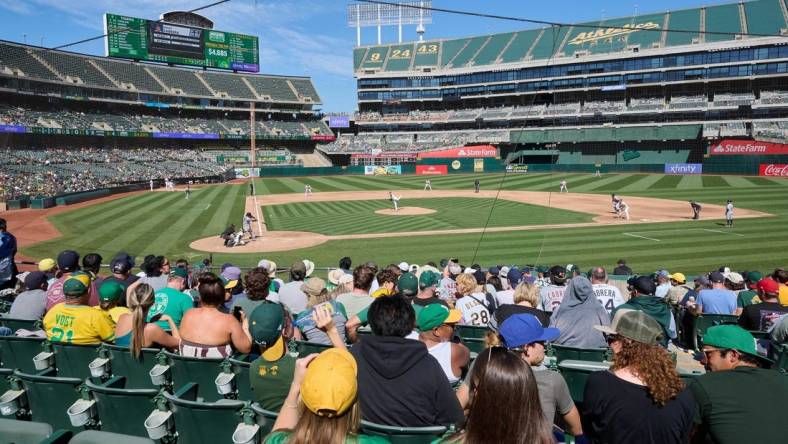 Sep 24, 2023; Oakland, California, USA; Fans watch Detroit Tigers designated hitter Miguel Cabrera (24) swing at a pitch against Oakland Athletics starting pitcher JP Sears (38) during the fifth inning at Oakland-Alameda County Coliseum. Mandatory Credit: Robert Edwards-USA TODAY Sports