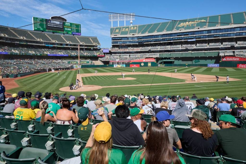 Sep 24, 2023; Oakland, California, USA; Fans watch Detroit Tigers designated hitter Miguel Cabrera (24) swing at a pitch against Oakland Athletics starting pitcher JP Sears (38) during the fifth inning at Oakland-Alameda County Coliseum. Mandatory Credit: Robert Edwards-USA TODAY Sports