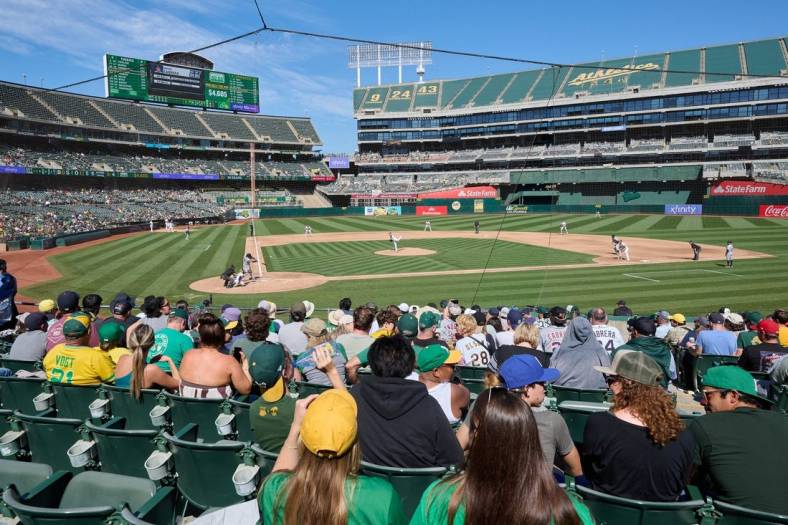 Sep 24, 2023; Oakland, California, USA; Fans watch Detroit Tigers designated hitter Miguel Cabrera (24) swing at a pitch against Oakland Athletics starting pitcher JP Sears (38) during the fifth inning at Oakland-Alameda County Coliseum. Mandatory Credit: Robert Edwards-USA TODAY Sports