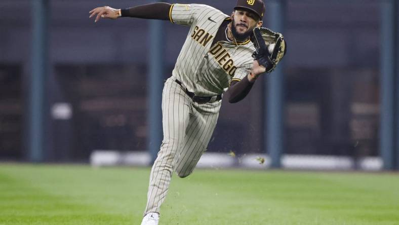 Sep 29, 2023; Chicago, Illinois, USA; San Diego Padres right fielder Fernando Tatis Jr. (23) catches a pop up ball hit by Chicago White Sox shortstop Tim Anderson during the ninth inning at Guaranteed Rate Field. Mandatory Credit: Kamil Krzaczynski-USA TODAY Sports