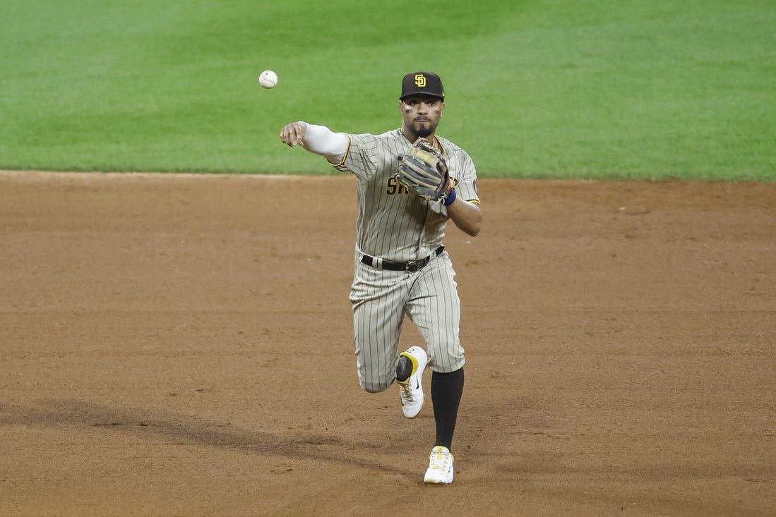 Sep 30, 2023; Chicago, Illinois, USA; San Diego Padres shortstop Xander Bogaerts (2) throws to first base for a Chicago White Sox out during the ninth inning at Guaranteed Rate Field. Mandatory Credit: Kamil Krzaczynski-USA TODAY Sports