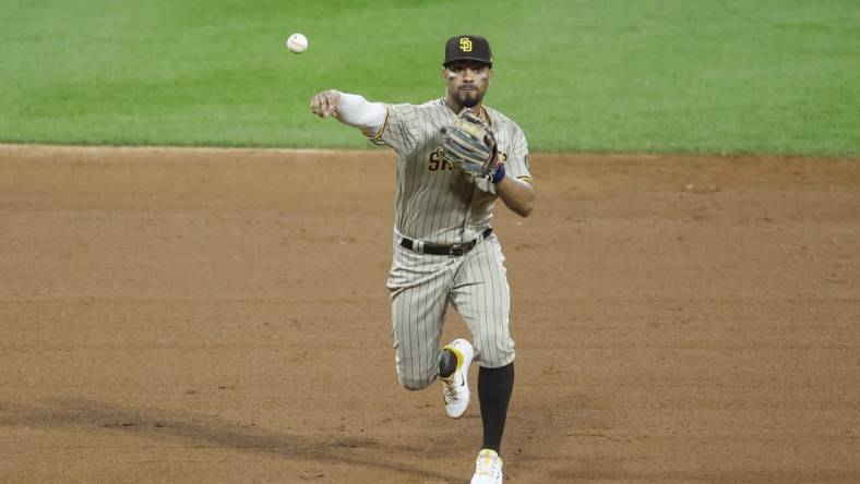 Sep 30, 2023; Chicago, Illinois, USA; San Diego Padres shortstop Xander Bogaerts (2) throws to first base for a Chicago White Sox out during the ninth inning at Guaranteed Rate Field. Mandatory Credit: Kamil Krzaczynski-USA TODAY Sports