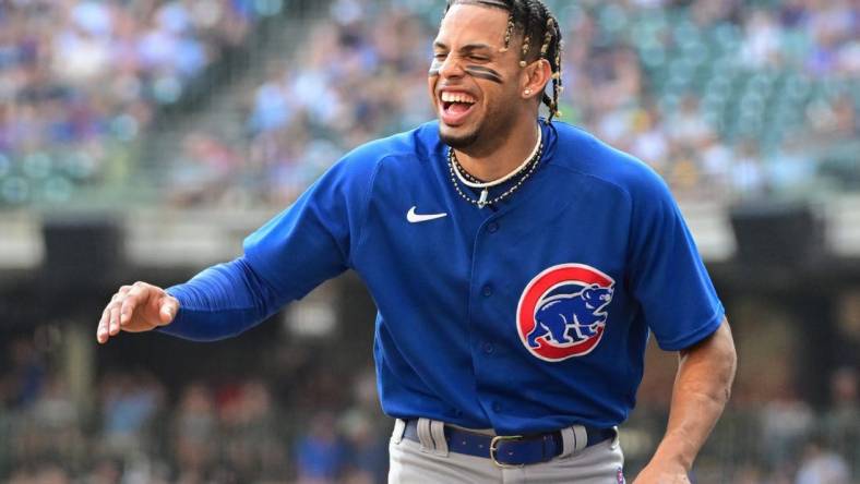 Oct 1, 2023; Milwaukee, Wisconsin, USA; Chicago Cubs shortstop Christopher Morel (5) jokes with teammates between innings against the Milwaukee Brewers at American Family Field. Mandatory Credit: Benny Sieu-USA TODAY Sports