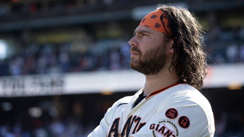 Oct 1, 2023; San Francisco, California, USA; San Francisco Giants shortstop Brandon Crawford watches a tape of season highlights following the final game of the season, against the Los Angeles Dodgers, at Oracle Park. Mandatory Credit: D. Ross Cameron-USA TODAY Sports