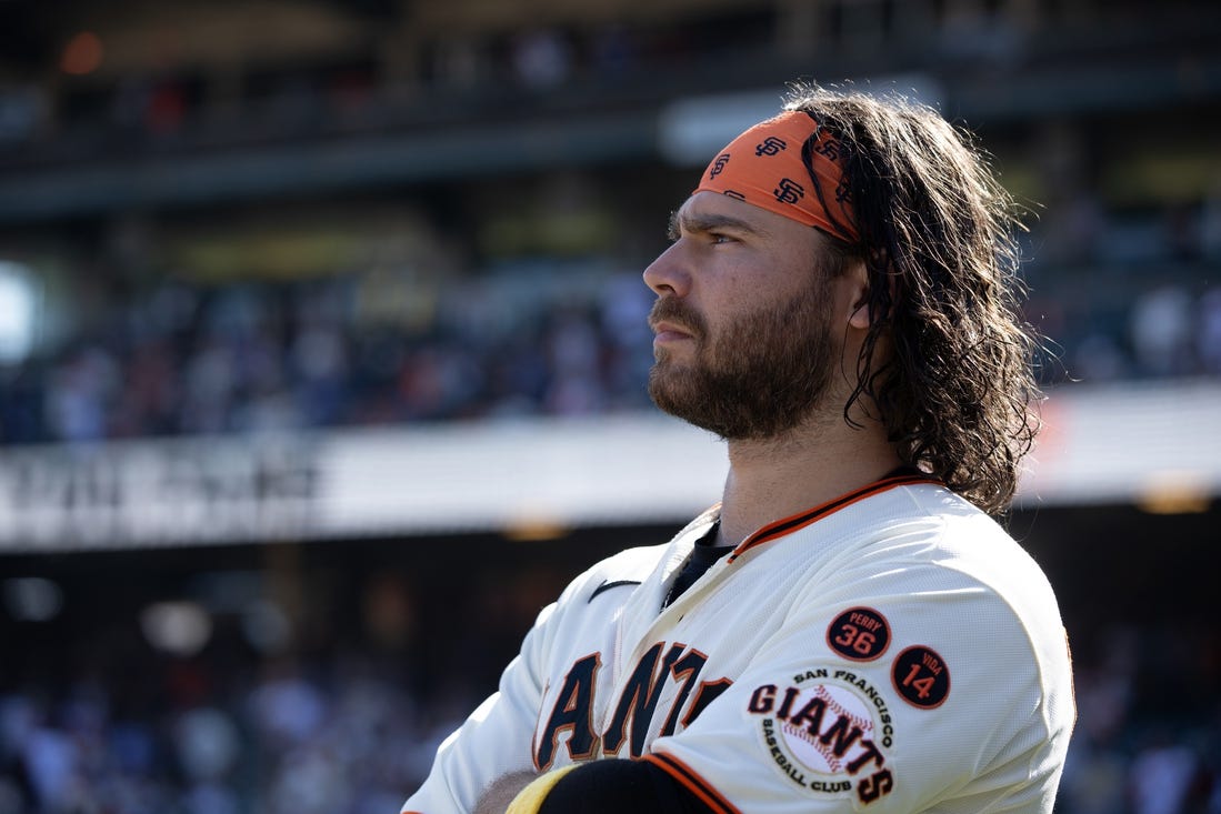 Oct 1, 2023; San Francisco, California, USA; San Francisco Giants shortstop Brandon Crawford watches a tape of season highlights following the final game of the season, against the Los Angeles Dodgers, at Oracle Park. Mandatory Credit: D. Ross Cameron-USA TODAY Sports