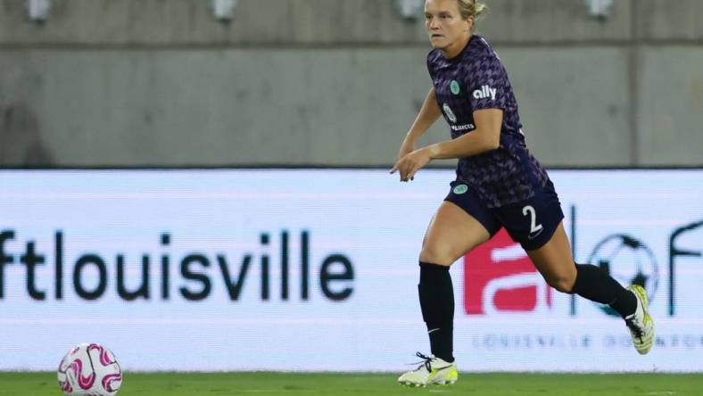 Oct 6, 2023; Louisville, Kentucky, USA; Racing Louisville's Lauren Milliet (2) looks to pass the ball in the first half against the Orlando Pride at Lynn Family Stadium. Mandatory Credit: EM Dash-USA TODAY Sports